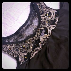 Black tunic with lace around neck